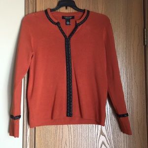 Pumpkin orange sweater with faux leather detail